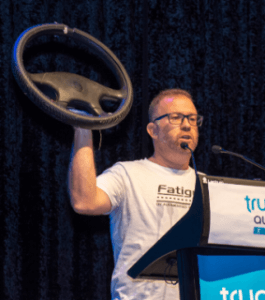 man holding a steering wheel