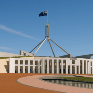 view of Parliament House in Canberra from slightly left of centre with blue sky above